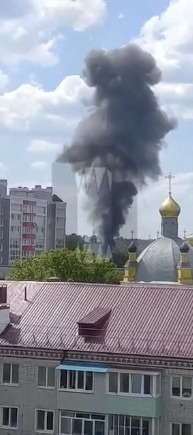 Smoke rises on the site of a helicopter crash in the town of Klintsy