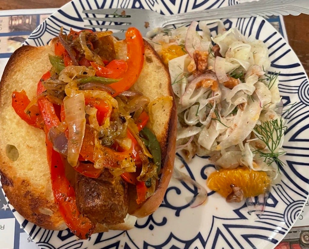 sausage and peppers sandwich with fennel and orange salad
