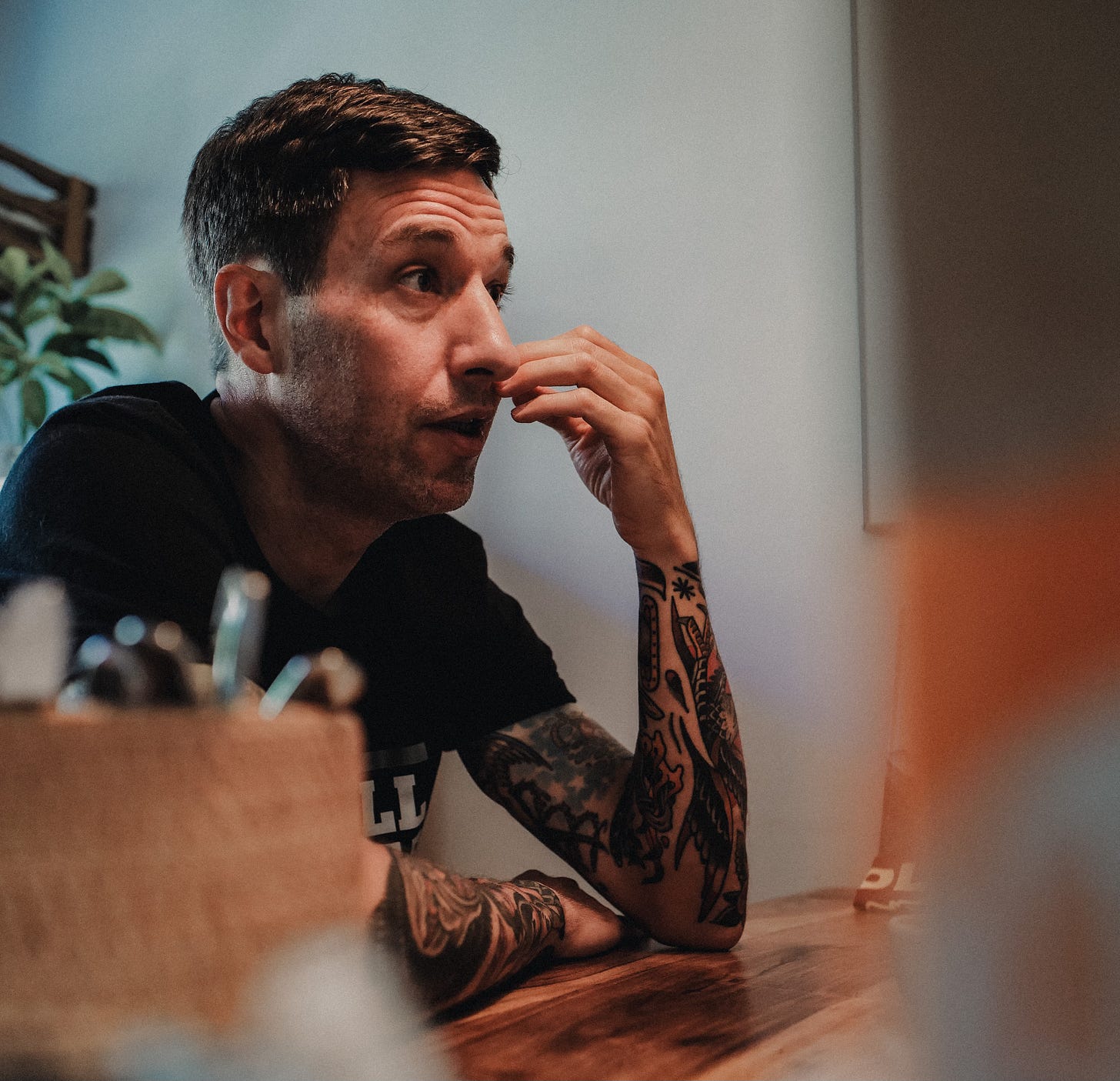 The author sitting on a table