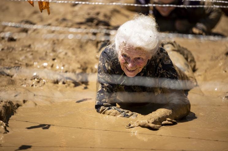 Mildred Wilson during Tough Mudder's Missouri 5K. See SWNS story SWNYmud. This octogenarian has just completed her THIRD Tough Mudder, one of the most grueling endurance events in the world. Mildred Wilson, 83, is the oldest person ever to complete the brutal course.Tough Mudder is an endurance race filled with punishing obstacles such as a giant ice bath, a 60-foot watery trench under a steel fence, a dash through 10,000 volts of electricity and a 12-foot wooden ladder with giant rungs named the “Ladder to Hell.”“I knew last year I would do another as long as my health was good,” said the former vending machine company worker from Sikeston, Missouri.