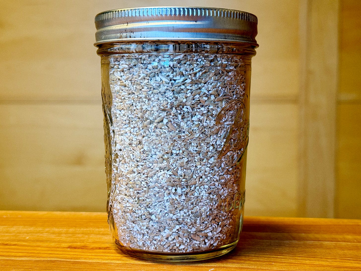 a small mason jar filled with home-milled rye chops