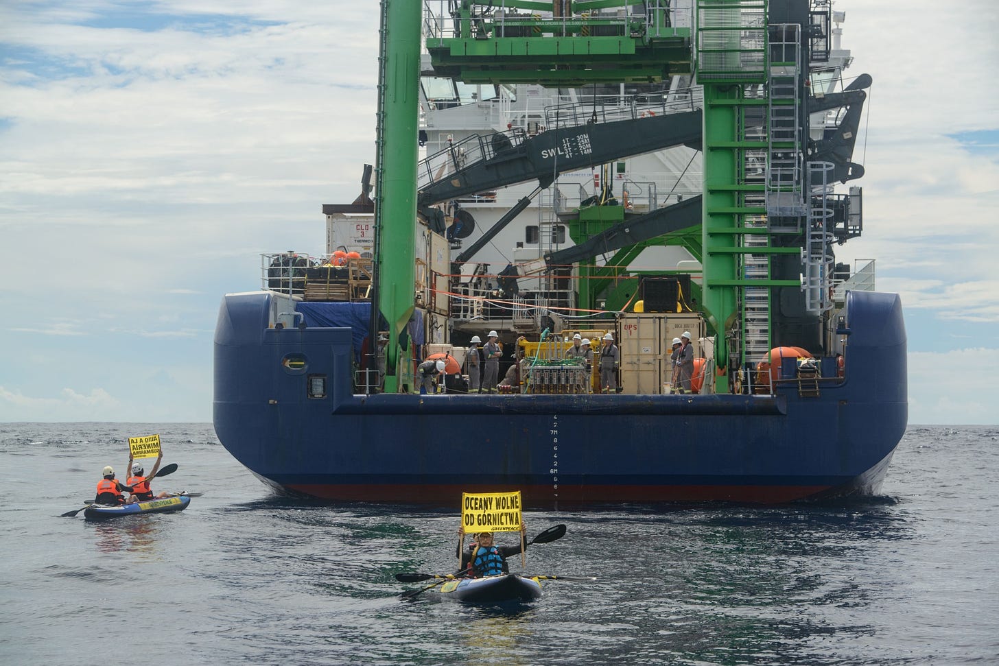 Greenpeace activists next to the&nbsp;MV Coco,&nbsp;a vessel researching deep sea mining on behalf of The Metals Company.