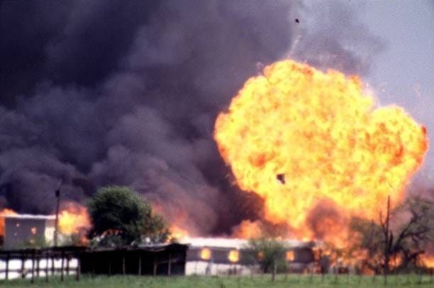 The Branch Davidian compound explodes in a burst of flames April 19 ending the standoff between cult leader David Koresh and his followers and the...