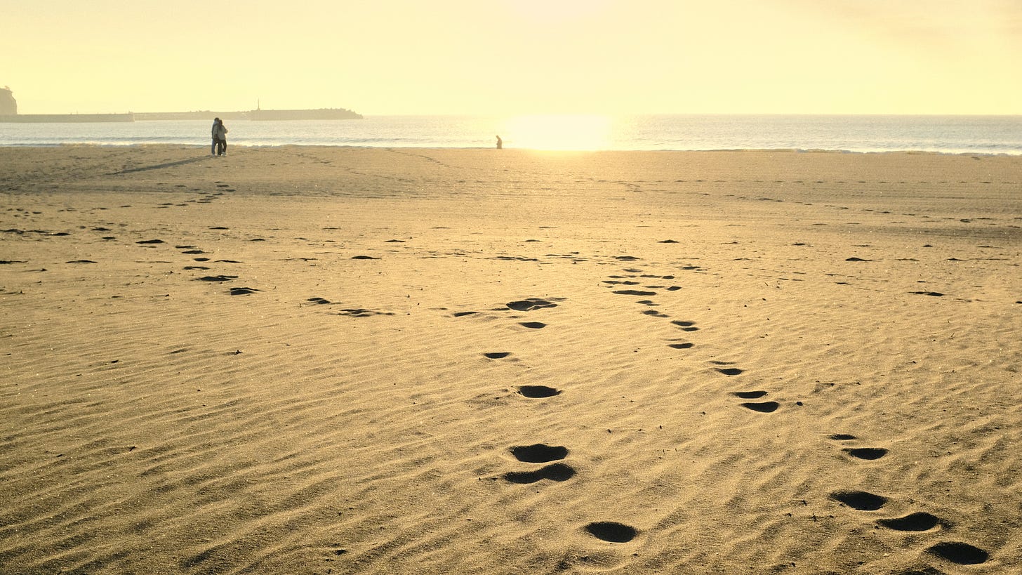ephemeral footsteps on the beach