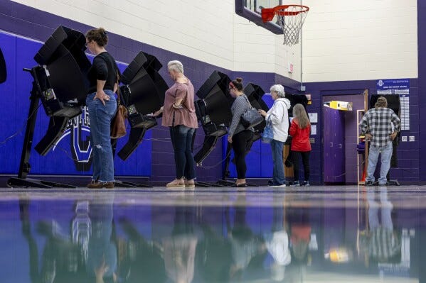 Voters fill out ballots on Election Day at Chesapeake Elementary School on Tuesday, Nov. 7, 2023, in Chesapeake, Ohio. (Sholten Singer/The Herald-Dispatch via AP)
