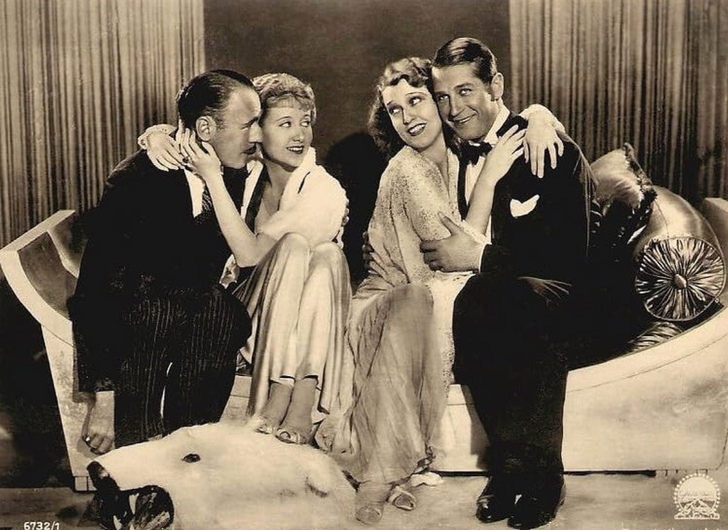 Roland Young, Genevieve Tobin, Jeanette MacDonald, and Maurice Chevalier in a promotional photo for One Hour With You