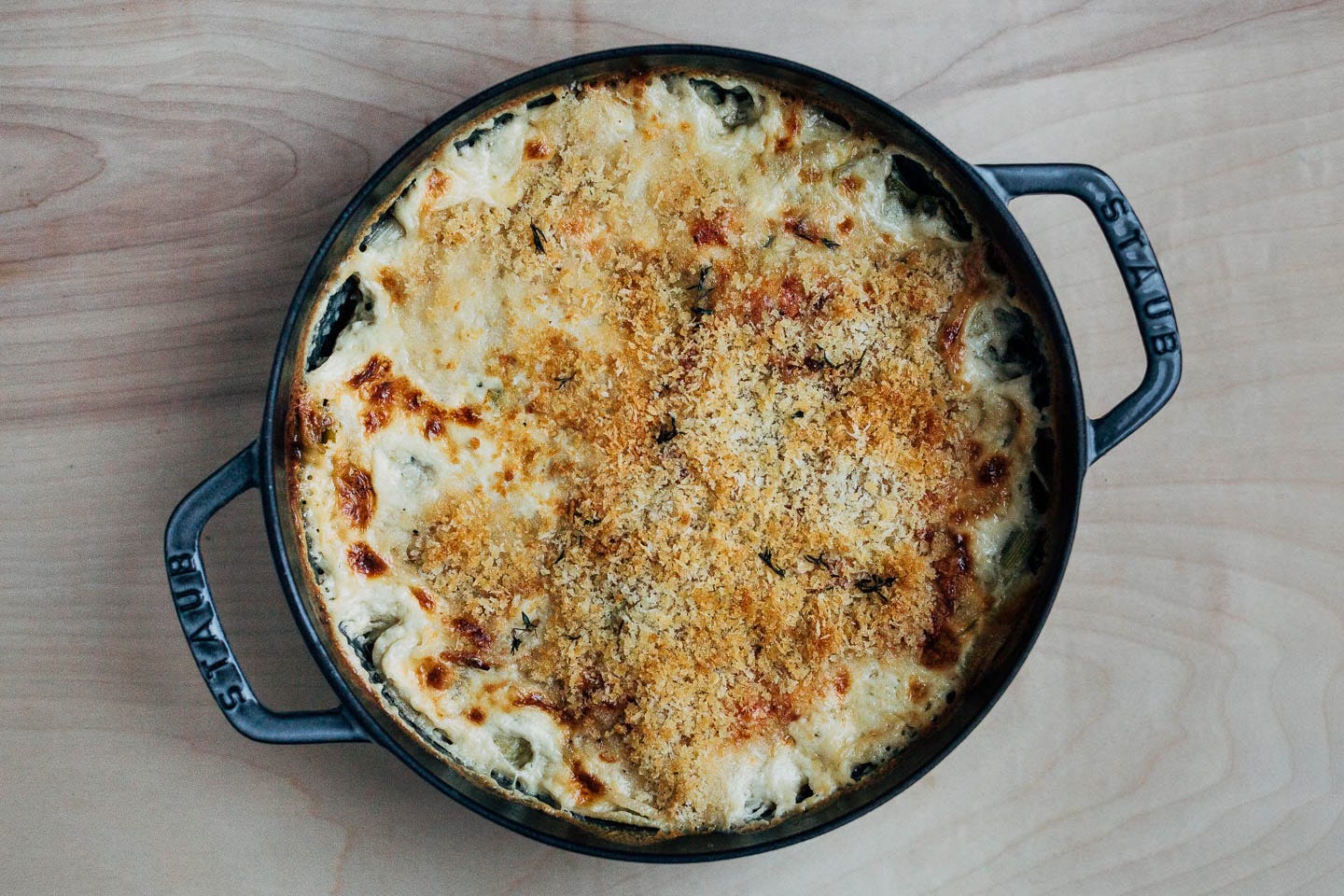 A baking dish of finished gratin with a golden panko top