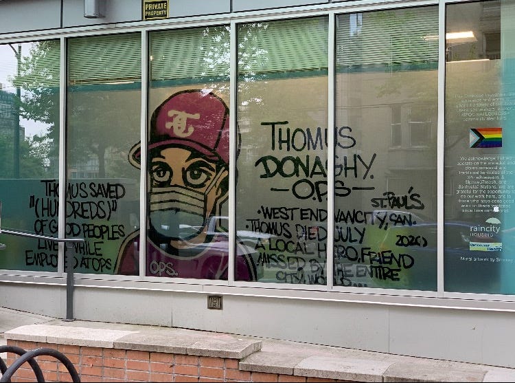A picture of the Yaletown overdose prevention site. Through the windows, one can see a mural depicting Thomus Donaghy, the harm reduction worker who died in July 2020 at the former OPS at St. Paul's Hospital.