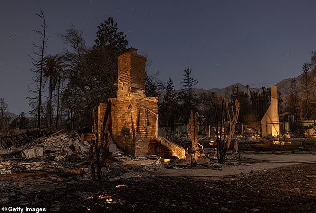 Homes that were destroyed in the Eaton Fire are left in the dark of night on January 12, 2025 in Altadena, California