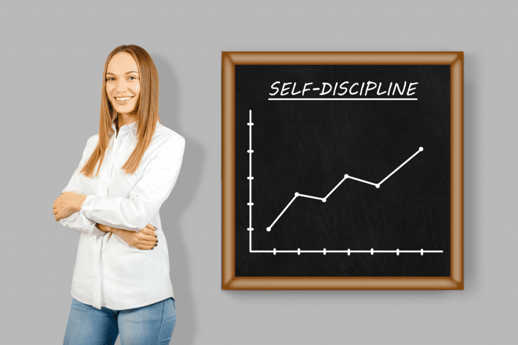 young woman standing next to chalkboard with self-discipline chart graph