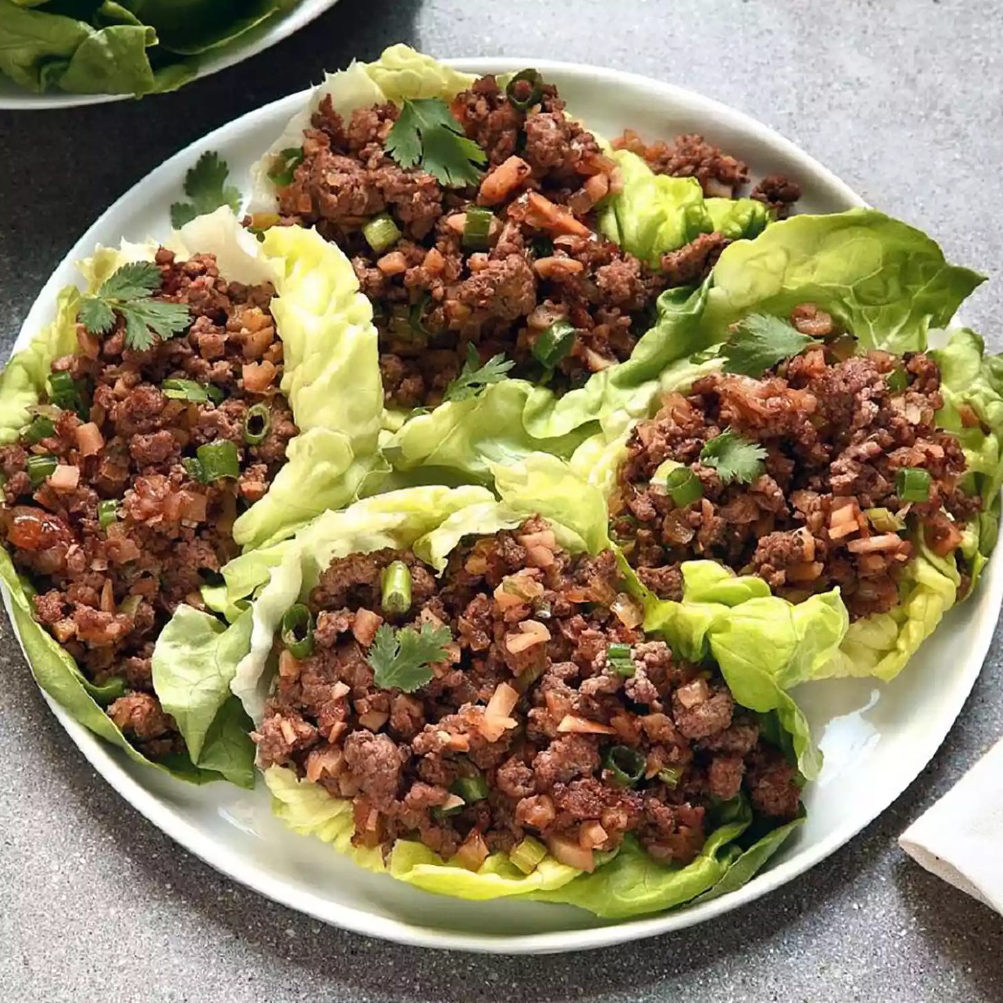 close up view of asian lettuce wraps on on a platter