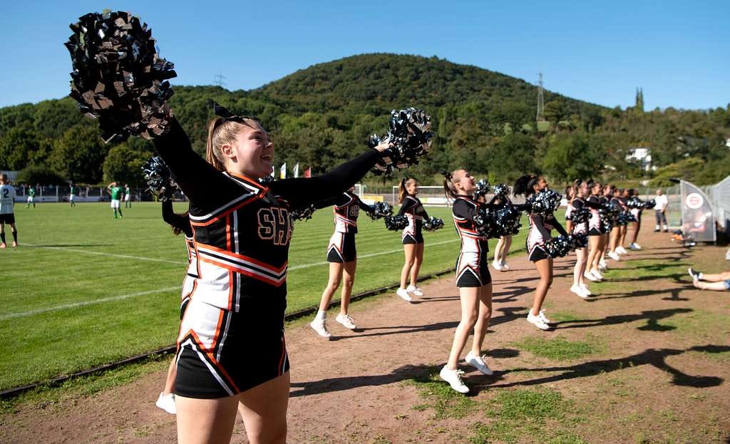 Spangdahlem High School cheerleaders cheer for the