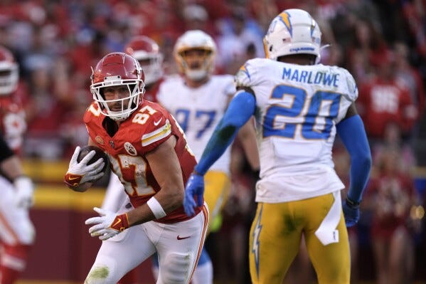 Mahomes throws for 424 yards and 4 TDs, Kelce has big day as Chiefs beat  Chargers 31-17 | AP News
