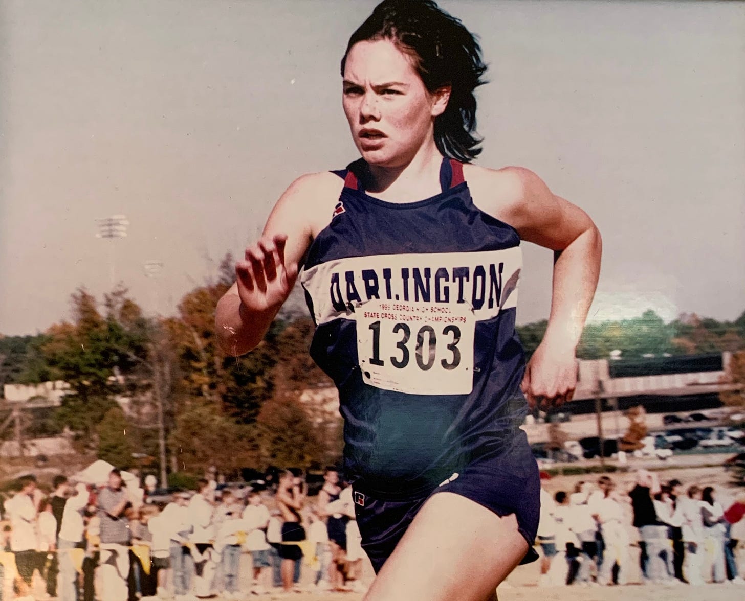 A photo of the author running in purple racing kit.
