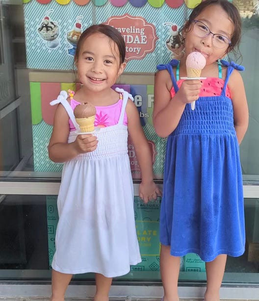 two little girls enjoying ice cream cones