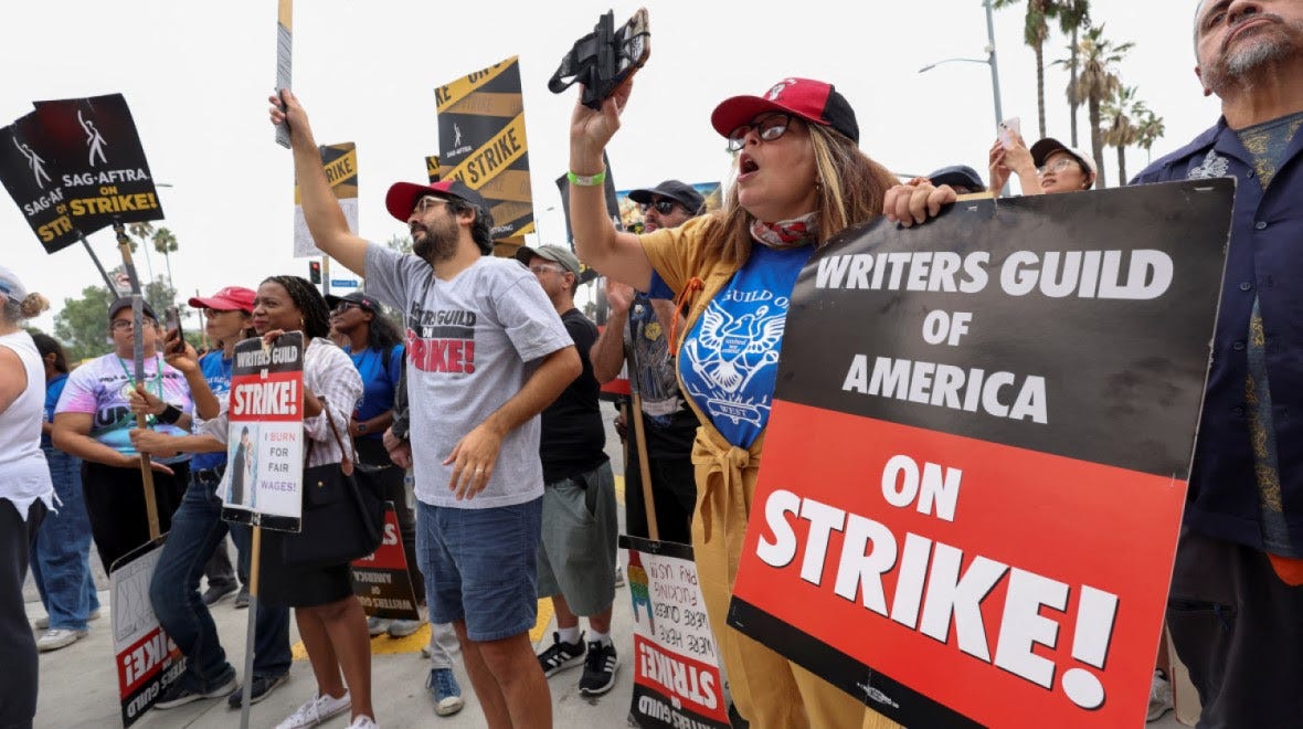 Protesters from the Writers Guild of America picketing.  