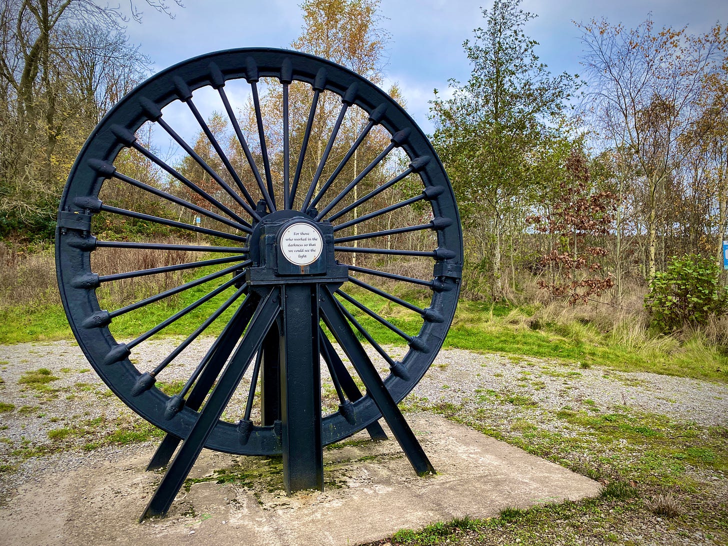 Colliery pit wheel at entrance to Silverdale Country Park.