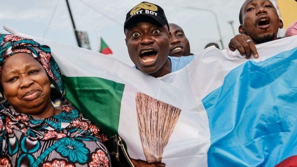 All Progressives Congress (APC) party supporters celebrate in Lagos on March 1, 2023 after party candidate Bola Tinubu won Nigeria's highly disputed weekend election