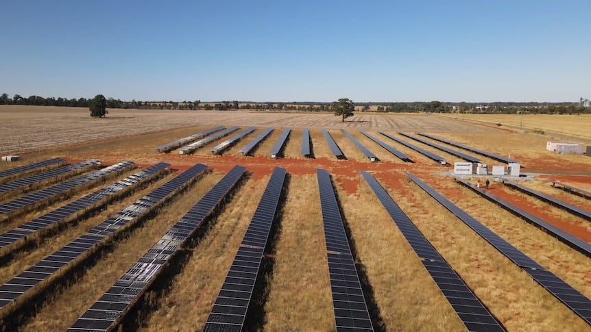 Arrays of solar panels on a rural property.