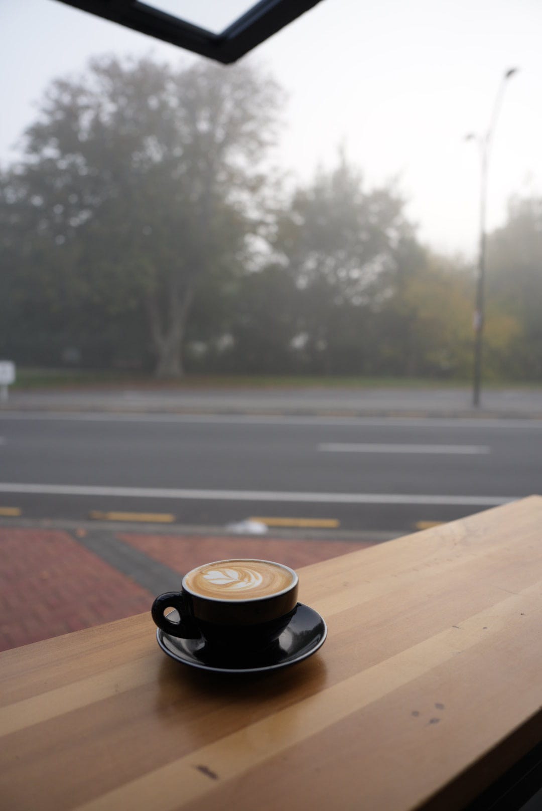 A cup of coffee on an autumnal morning