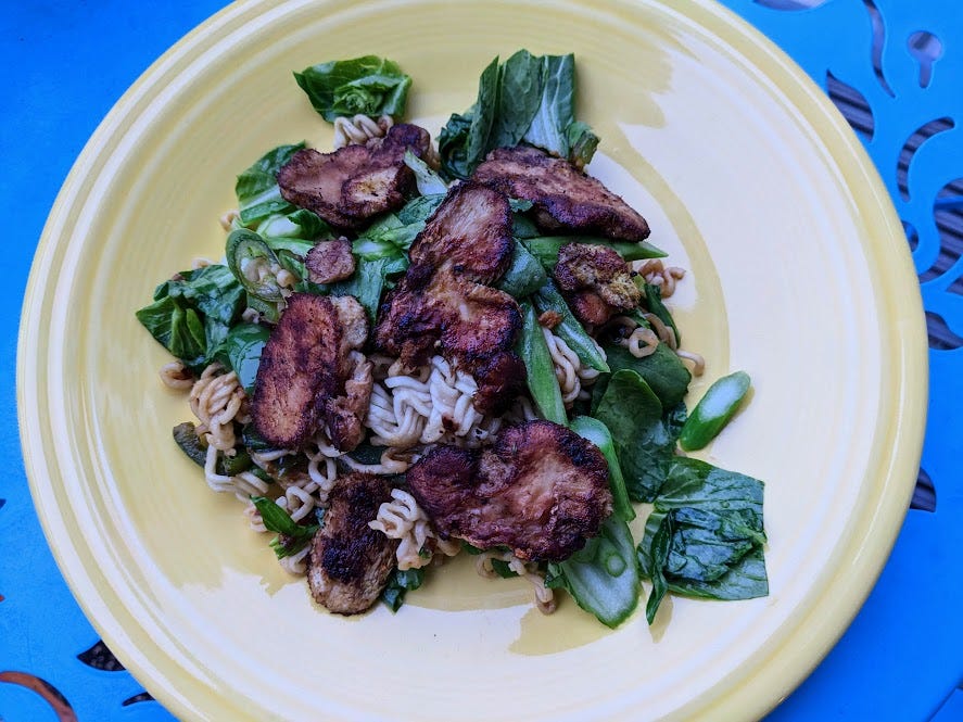 sauteed mushrooms and greens over ramen noodles