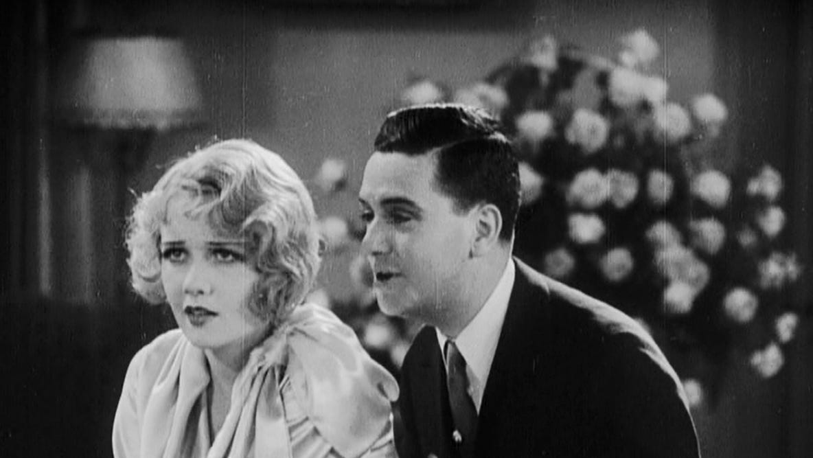 Anita Page and Charles King in a scene from The Broadway Melody