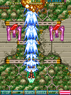 A screenshot from the arcade version of V-V, where the four options in Shot mode are all in front of the ship, creating a focused, blue laser blast that's wider than the ship firing it.