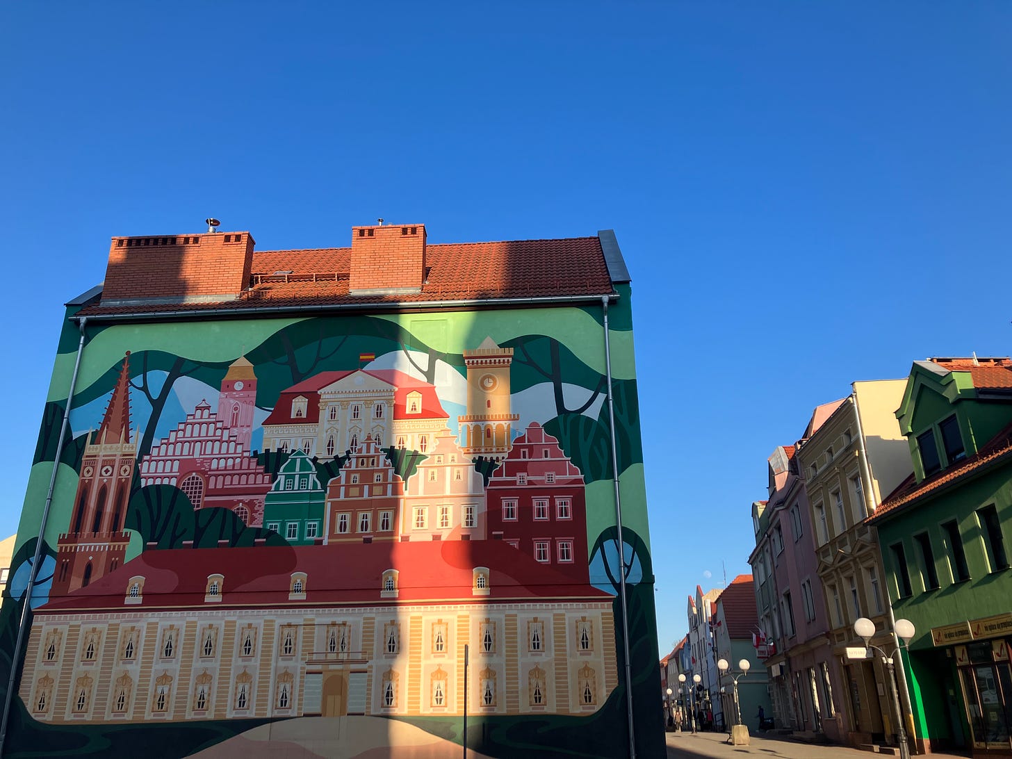 A colourful mural of Zagan on a building in Zagan on a sunny day.