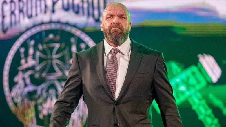 Paul "Triple H" Levesque wearing a suit on WWE television