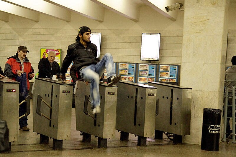 File:Turnstile jumping in Moscow Metro (1).jpg