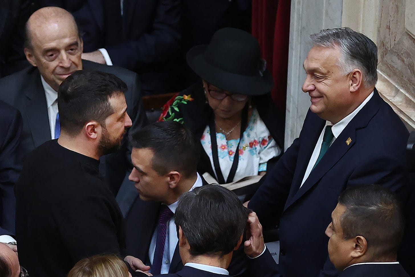 Ukrainian President Volodymyr Zelensky chats with Hungarian Prime Minister Viktor Orban.