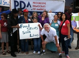 PDA members, including Advisory Board Chair Mimi Kennedy, protested food stamp cuts in front of Congressman Henry Waxman's office.