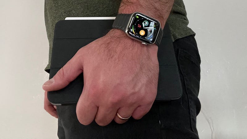 Holding the iPad Mini in a smart cover.