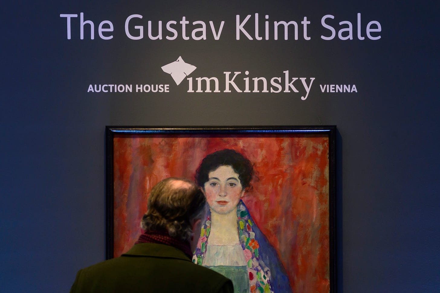 A man looks at the painting 'Portrait of Fräulein Lieser' by Austrian painter Gustav Klimt prior to an auction in Vienna.
