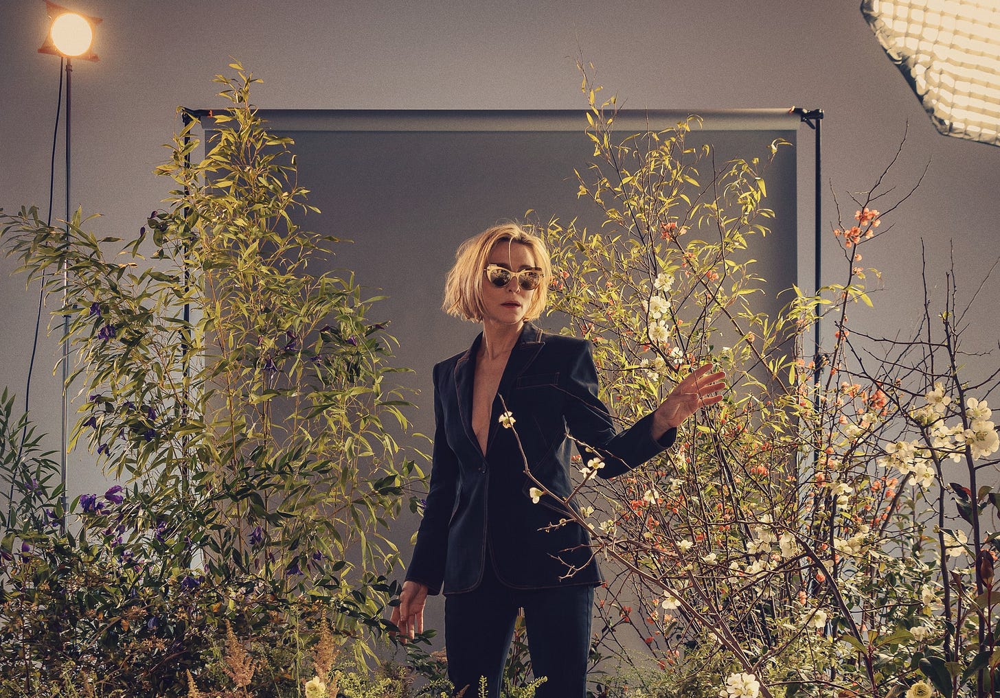 Cate Blanchett photographed surrounded by plants, to promote The Seagull