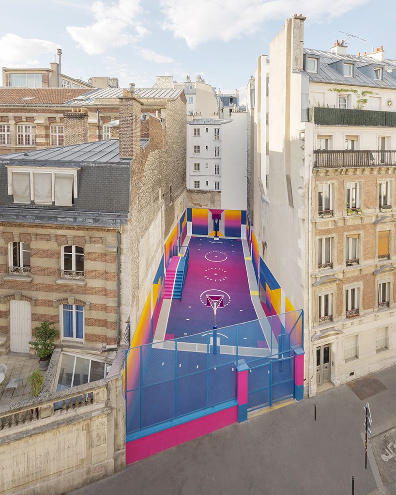 paris' pigalle basketball court canvassed in a gradient of smooth,  iridescent hues