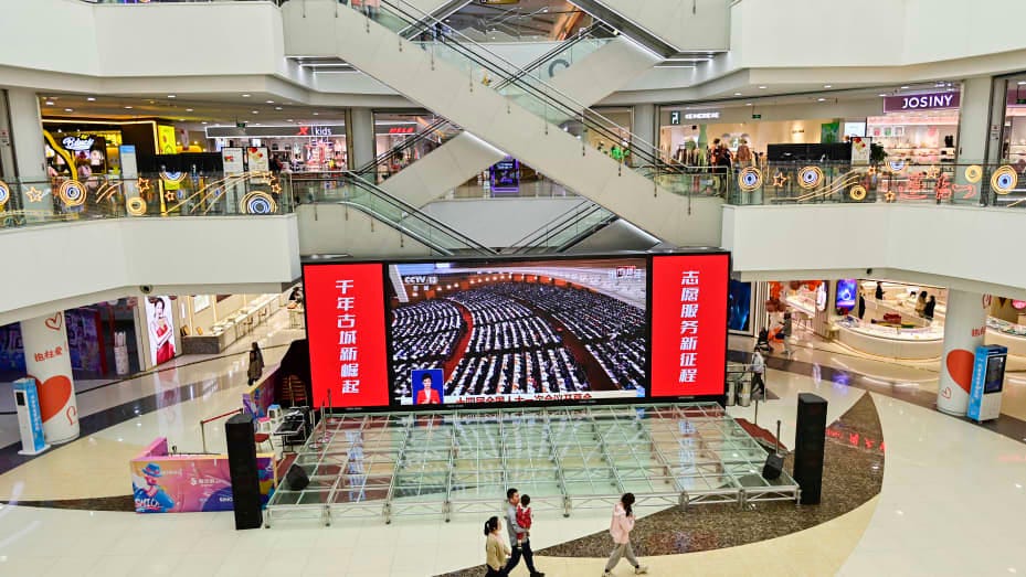 QINGZHOU, CHINA - MARCH 5, 2023 - People watch the opening of the first session of the 14th National People's Congress on a big screen at a shopping mall in Qingzhou, East China's Shandong Province, March 5, 2023. (Photo credit should read CFOTO/Future Publishing via Getty Images)