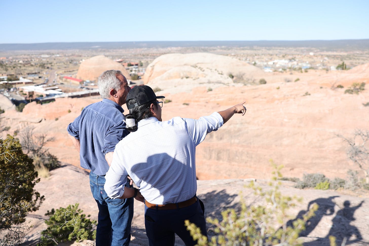 May be an image of 2 people and Uluru