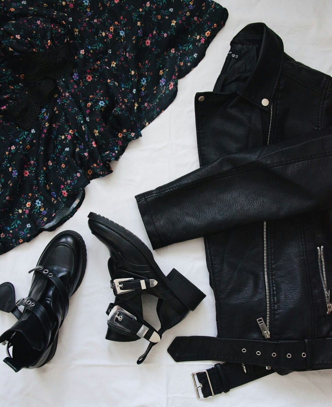 black leather belt on black and white floral button up shirt black leather belt on black and white floral button up shirt