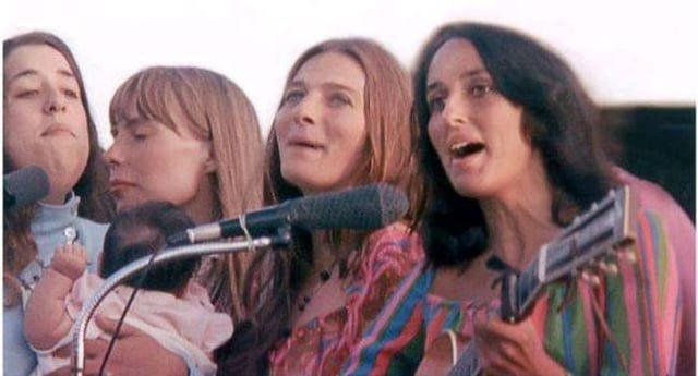 r/OldSchoolCool - a group of people singing into a microphone