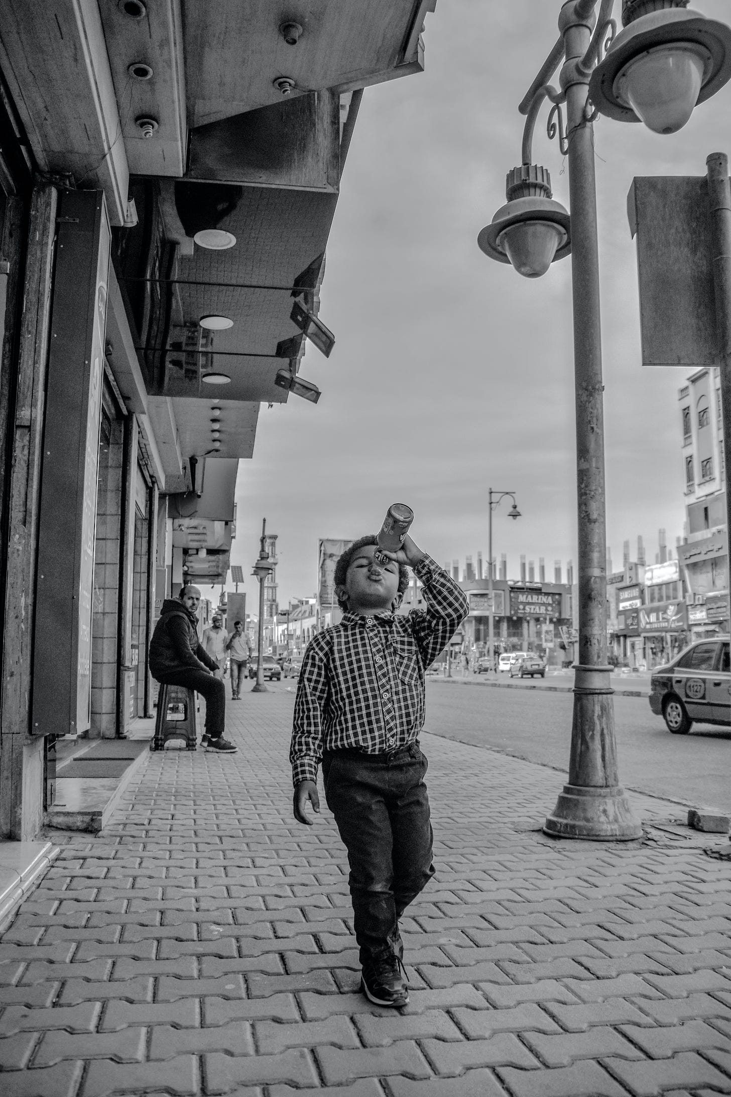 Drinking on down the street. Photo by Lian Rodriguez on Pexels