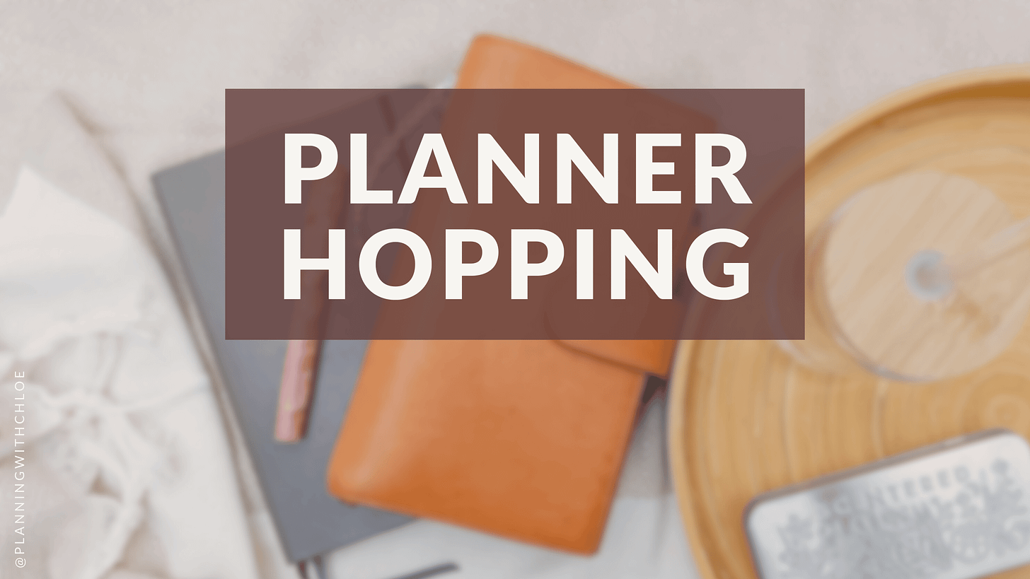 Text: Planner Hopping. Img: a stack of notebooks/journals on a blanket with a tray