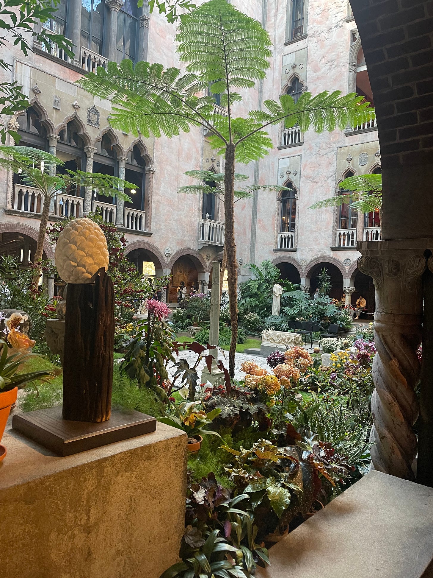 Pictured above is the pine cone, noted by Diana, sitting on the edge of the Museum's Courtyard