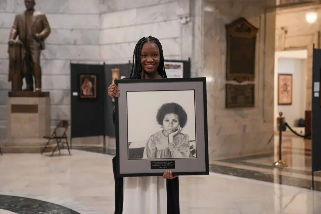 Laurissa Kabithe with bell hooks portrait