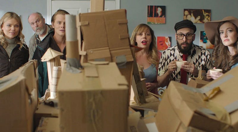 Image of friends gathered around a cardboard fort from the movie Dave Made a Maze | Gravitas Ventures