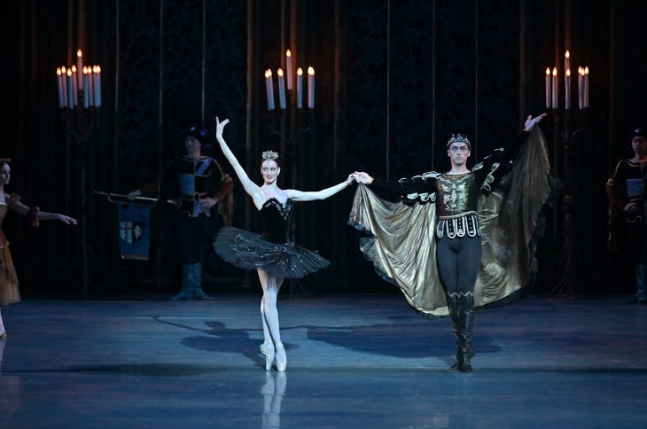 Two ballet dancers performing on stage