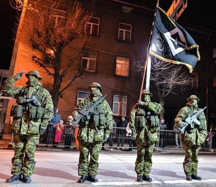 Estonia's most elite soldiers from Estonian Special Operations Forces ESTSOF standing in front of the unit's flag