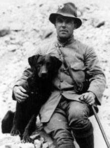 A black and white photo of botanist George Forrest and his cute dog.