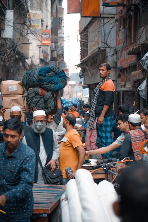 Free People walking on busy street in Asia Stock Photo