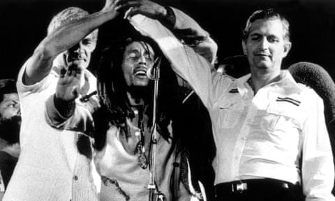Edward Seaga, right, clasping hands with Michael Manley, left, and Bob Marley during the One Love concert at the national stadium in Kingston, Jamaica, on 22 April 1978.
